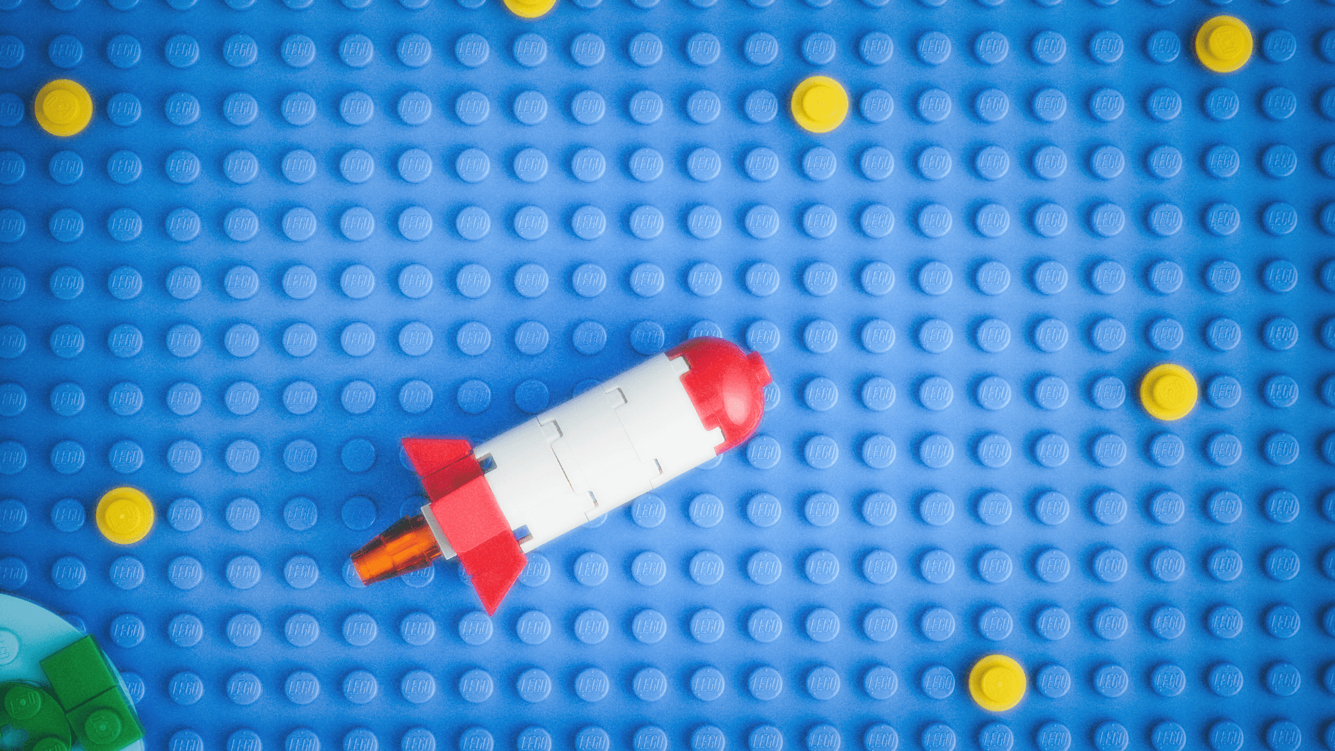 Lego rocket ship on blue lego background